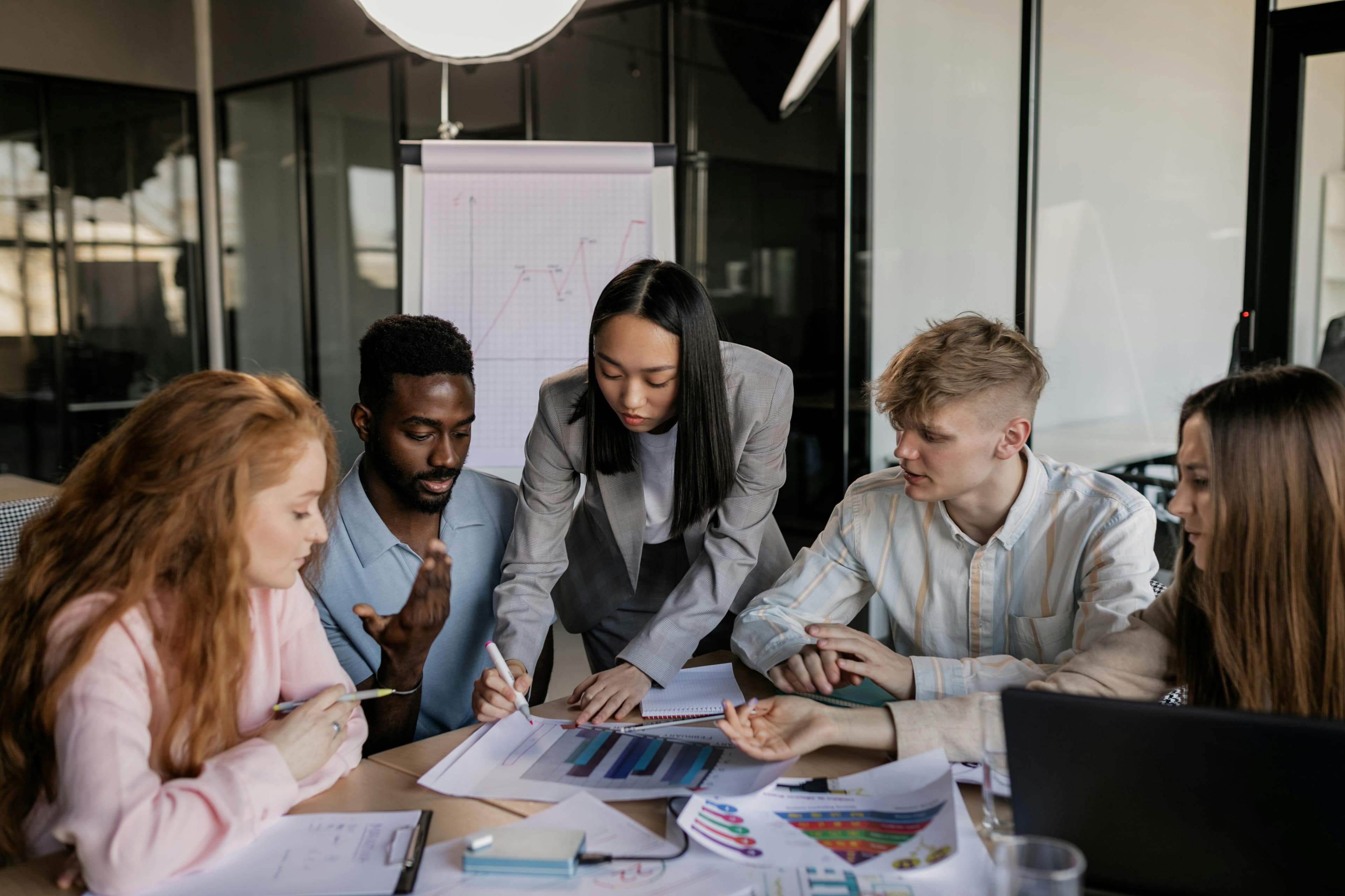 A team of educators meeting around a conference table.